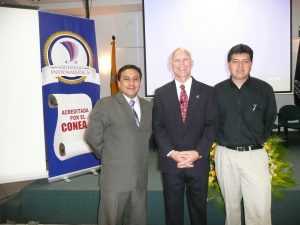 Dr. Switzer with two gentleman from a leadership session in Ecuador.